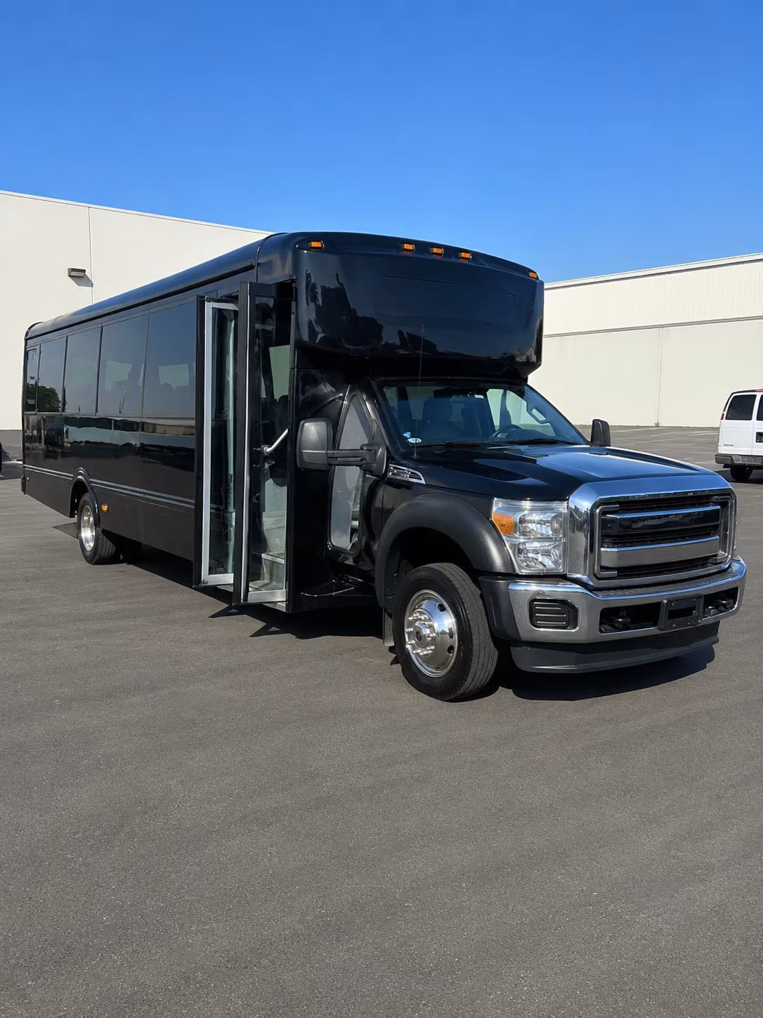 Group beside a Mercedes Sprinter limo in Visalia